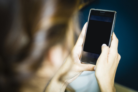 Hands using a smart phone in outdoorの写真素材