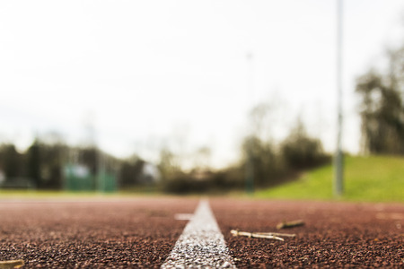 red rubber racetracks in outdoor stadiumの写真素材