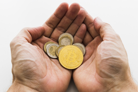 A Bitcoin Cryptocurrency Digital Bit Coin BTC Currency Technology Business Internet Concept. Hands holding Bitcoinの写真素材