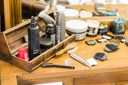 A wooden table with shaving utensils in a barber shopのeditorial素材