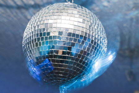A party with disco ball with blue lightsの写真素材