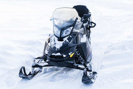 A snowmobile in snowy landscape in Finlandのeditorial素材