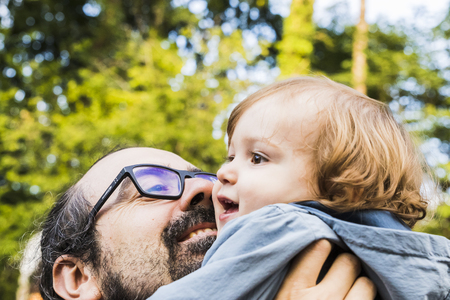 A father with his baby in his armsの写真素材