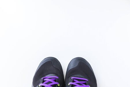 A fitness concept. Sport shoes on white background with copyspace.の写真素材