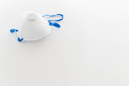 A mask for coronavirus protection with copyspace on white backgroundの写真素材