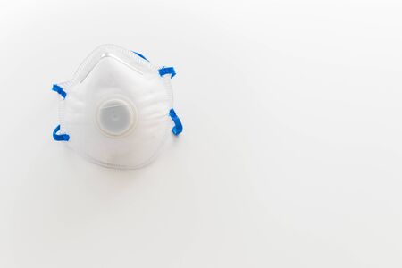 A mask for coronavirus protection with copyspace on white backgroundの写真素材