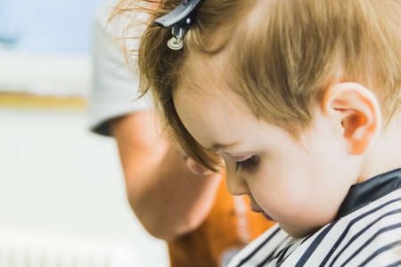 A little boy in a hairdressing salonの写真素材