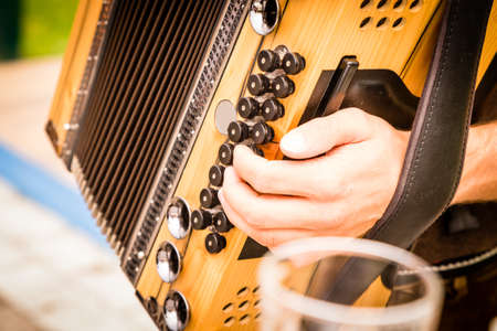 man hand playing accordionの写真素材