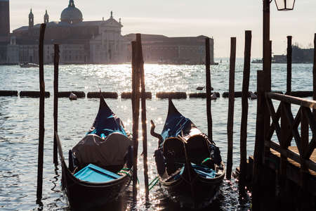 A several gondolas moored in Veniceの写真素材