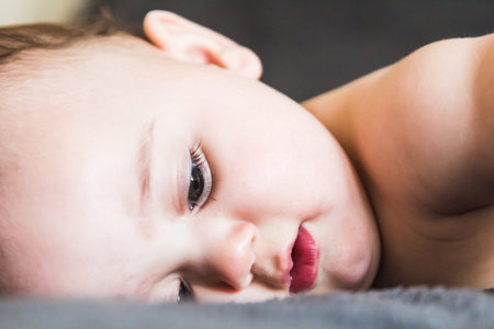 A portrait of adorable baby lyingの写真素材