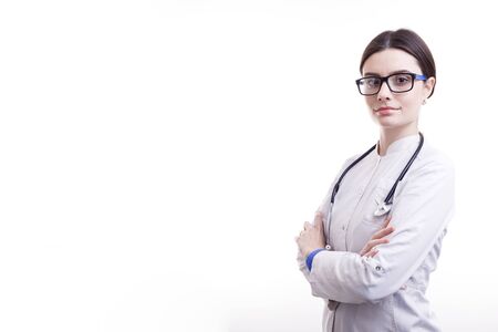 Young Smiling Female Doctor in Scrubs With Stethoscope Posingの写真素材