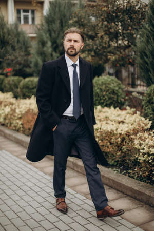 Businessman in suit standing on streetの写真素材