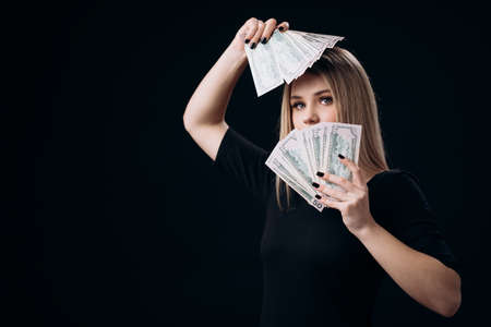 Stunning woman holding money cash