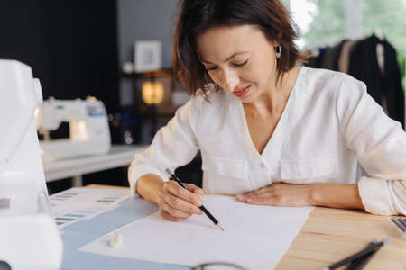 Designer drawing a sketches for new collectionの写真素材