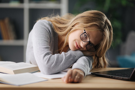 Student resting on tableの写真素材
