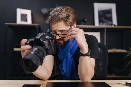 Man with photo cameraの写真素材