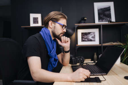 Photographer editing photosの写真素材