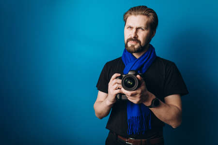 Photographer with camera in studio