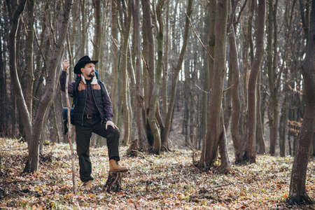 Hiker standing at forestの写真素材