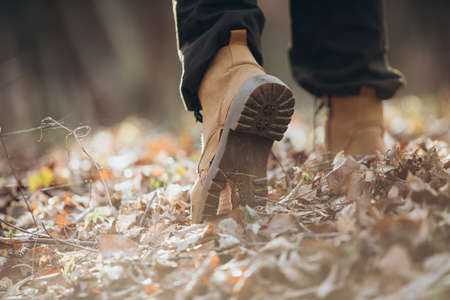 Hiker in boots walking outdoors