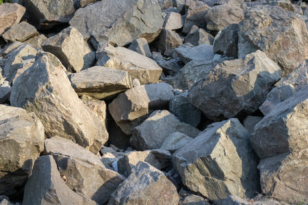Pile of stones closeup in highlands. Destroyed rock formations in mountainous area on sunny day.の写真素材