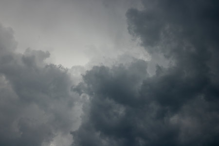 Background consists of large gray clouds in sky before heavy rain. Natural background. Weather forecast concept.の写真素材