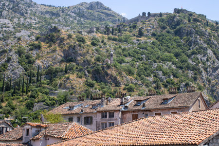 Old town of Kotor Montenegro on the mountains and blue sky background. The bright beautiful landscape in the summer on a clear day.の写真素材