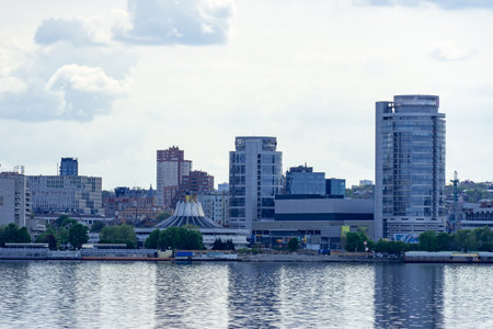 Panoramic view on the central part of Dnipro city and river bank in the Ukraine. Urban landscape with shopping centers, business offices and high-rise apartments. Beautiful embankmentの写真素材