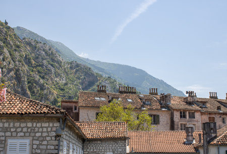 Old town of Kotor Montenegro on the mountains and blue sky background. The bright beautiful landscape in the summer on a clear day.の写真素材