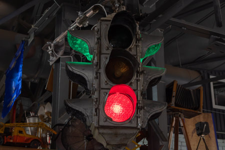 Vertical vintage traffic light close-up. Metallic old-fashioned stoplight. Safety equipment is road...