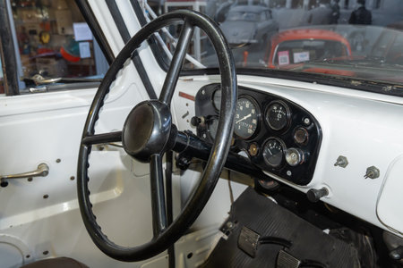 Steering wheel of vintage car close-up. Interior of old-fashioned classic automobile. Good condition...