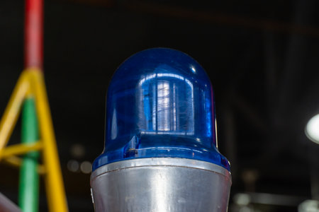 Vintage blue emergency vehicle warning and flashing lights. Police car rooftop strobe lights. Bright beacon siren light mounted and rotating. Emergency services vehicle lighting.の写真素材