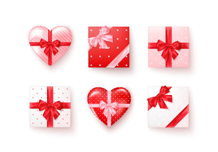 Set of gift boxes with silk bows in realistic style top view. Square and heart shape boxes different colors. Vectorのイラスト素材