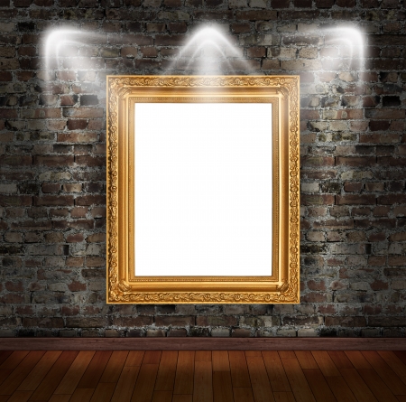 Gold frame on brick wall in grunge roomの写真素材
