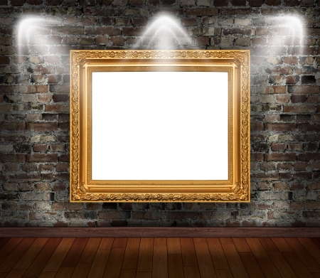 Gold frame on brick wall in grunge roomの写真素材