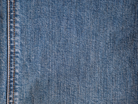 Jeans cloth fabric pattern background. Closedup blue jeans textile style for background.の写真素材