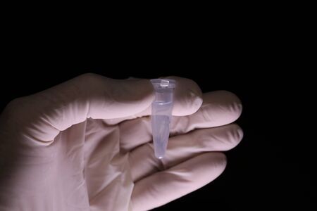 Blue fluid in test tube in laboratory settingの写真素材