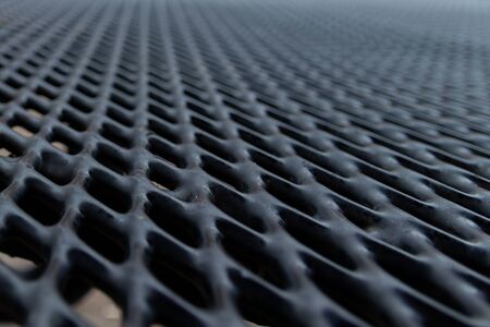 Selective focus on black steel grid