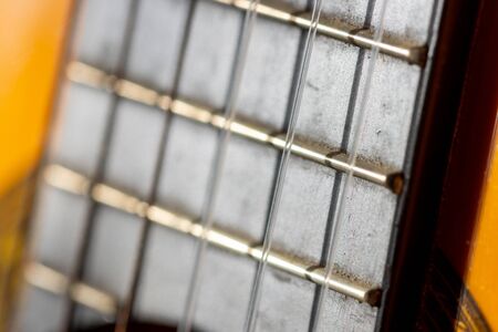 Selective focus on fretboard or acoustic guitarの写真素材