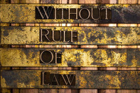 Without Rule Of Law text formed with real authentic typeset letters on vintage textured silver...