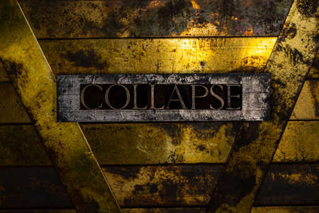 Collapse text message on textured grunge copper and vintage gold backgroundの写真素材