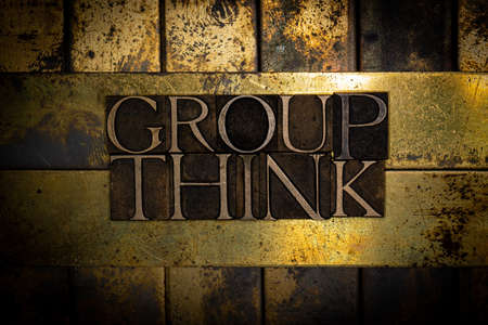 Group Think text message on vintage textured grunge copper and gold backgroundの写真素材