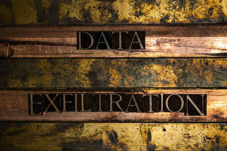 Data Exfiltration text on grunge textured silver and gold backgroundの写真素材