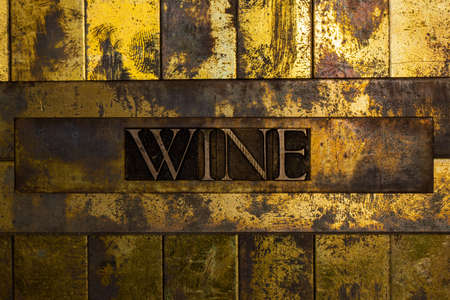 Wine text on grunge textured copper and gold backgroundの写真素材