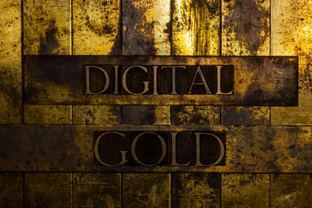 Digital Gold text on textured grunge copper and vintage gold backgroundの写真素材