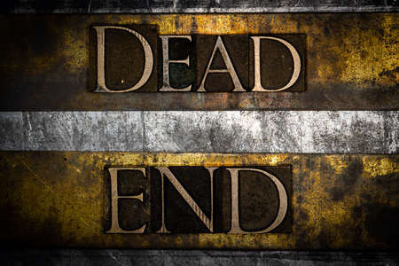 Dead End text on vintage textured grunge copper gold and silver backgroundの写真素材