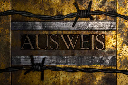 Ausweis text on textured grunge copper and vintage gold backgroundの写真素材