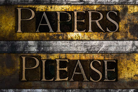 Papers Please text on textured grunge copper and vintage gold backgroundの写真素材