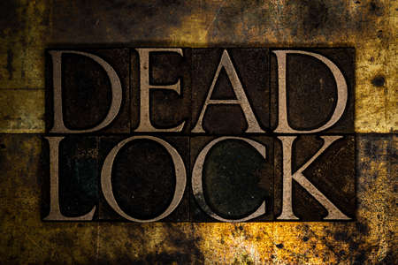 Deadlock text on textured grunge copper and vintage gold background
