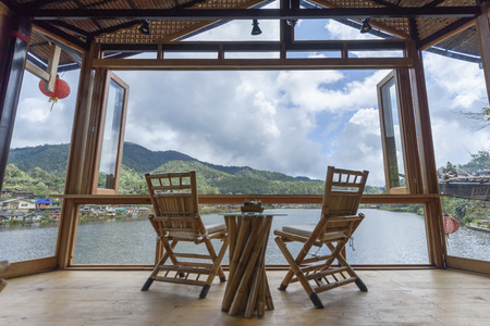 Terrace of cafe near the lake and hillの写真素材
